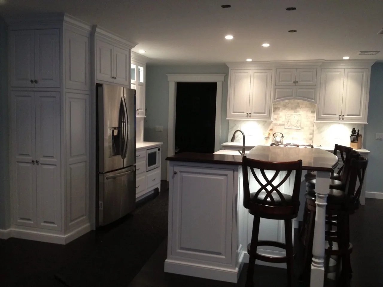 white kitchen with island and bar stools, Kitchens & Vanities